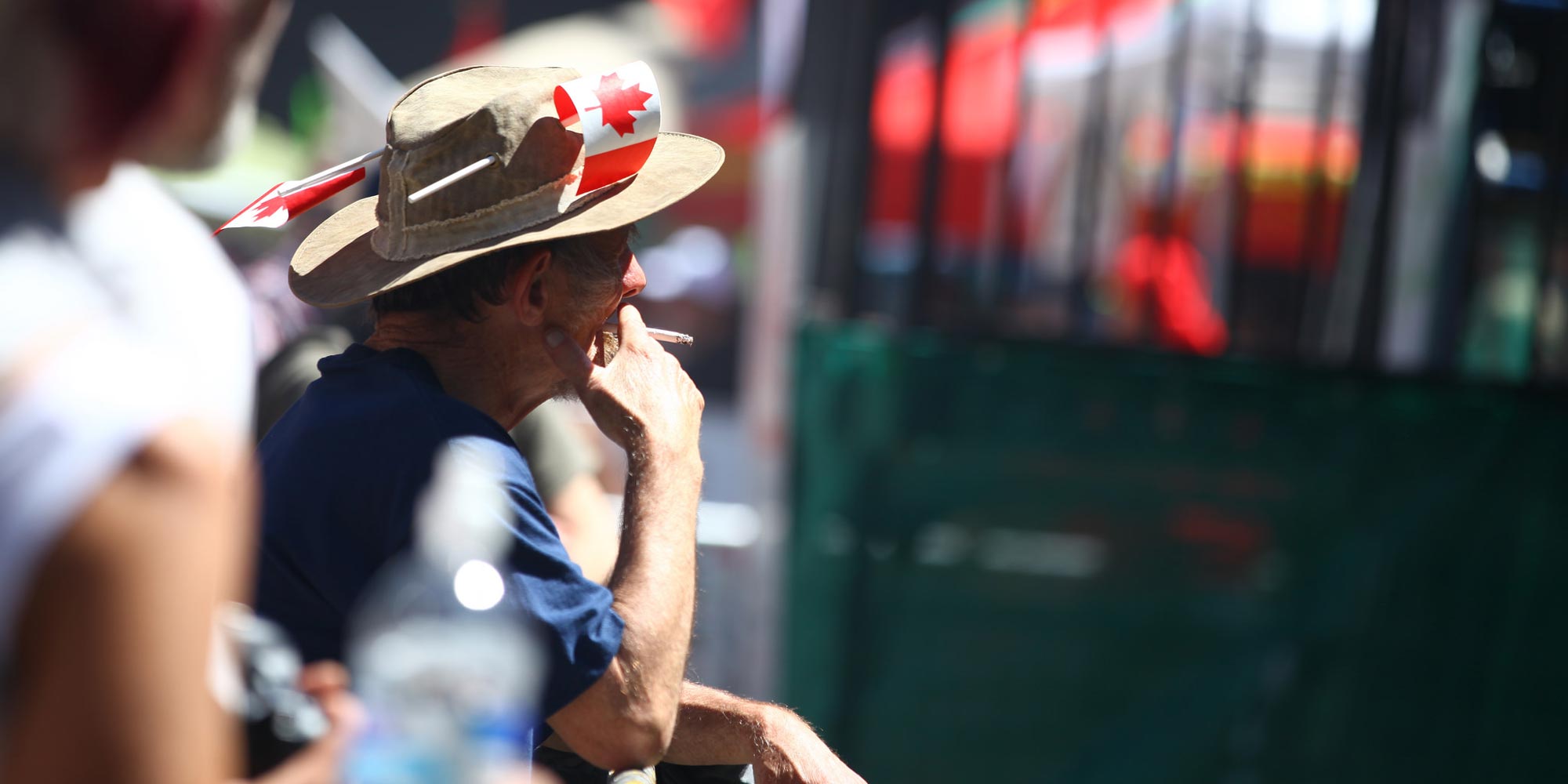 A man wearing a Canada hat at a Cannabis Day party in 2014